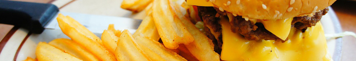 Eating American (Traditional) Burger at Devine's Restaurant & Sports Bar restaurant in Durham, NC.